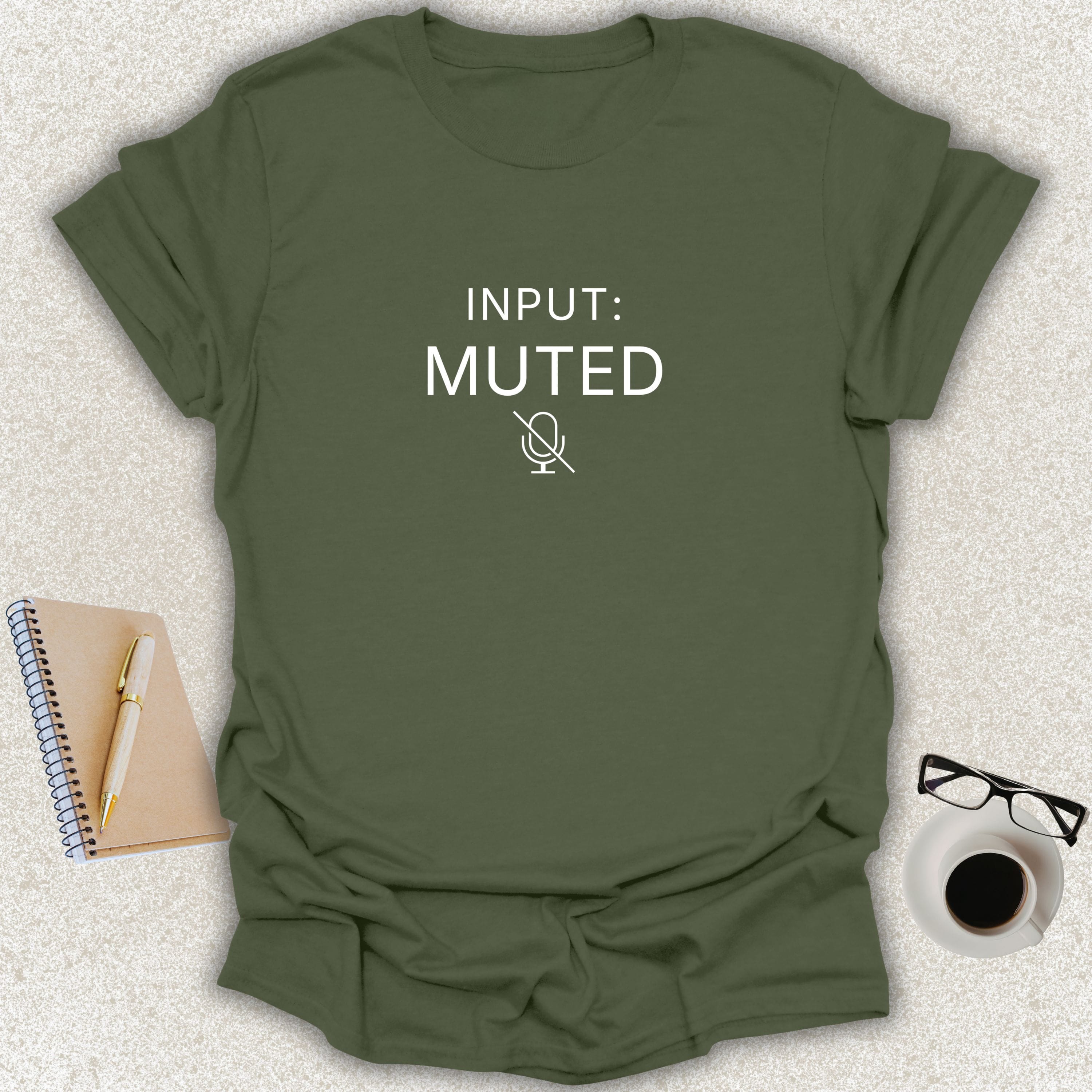 Low Signal INPUT: MUTED minimalist typography t-shirt with muted microphone icon on military green Gildan Softstyle tee