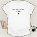 Low Signal NOTIFICATIONS: OFF minimalist typography t-shirt with muted notification bell icon on white Gildan Softstyle tee