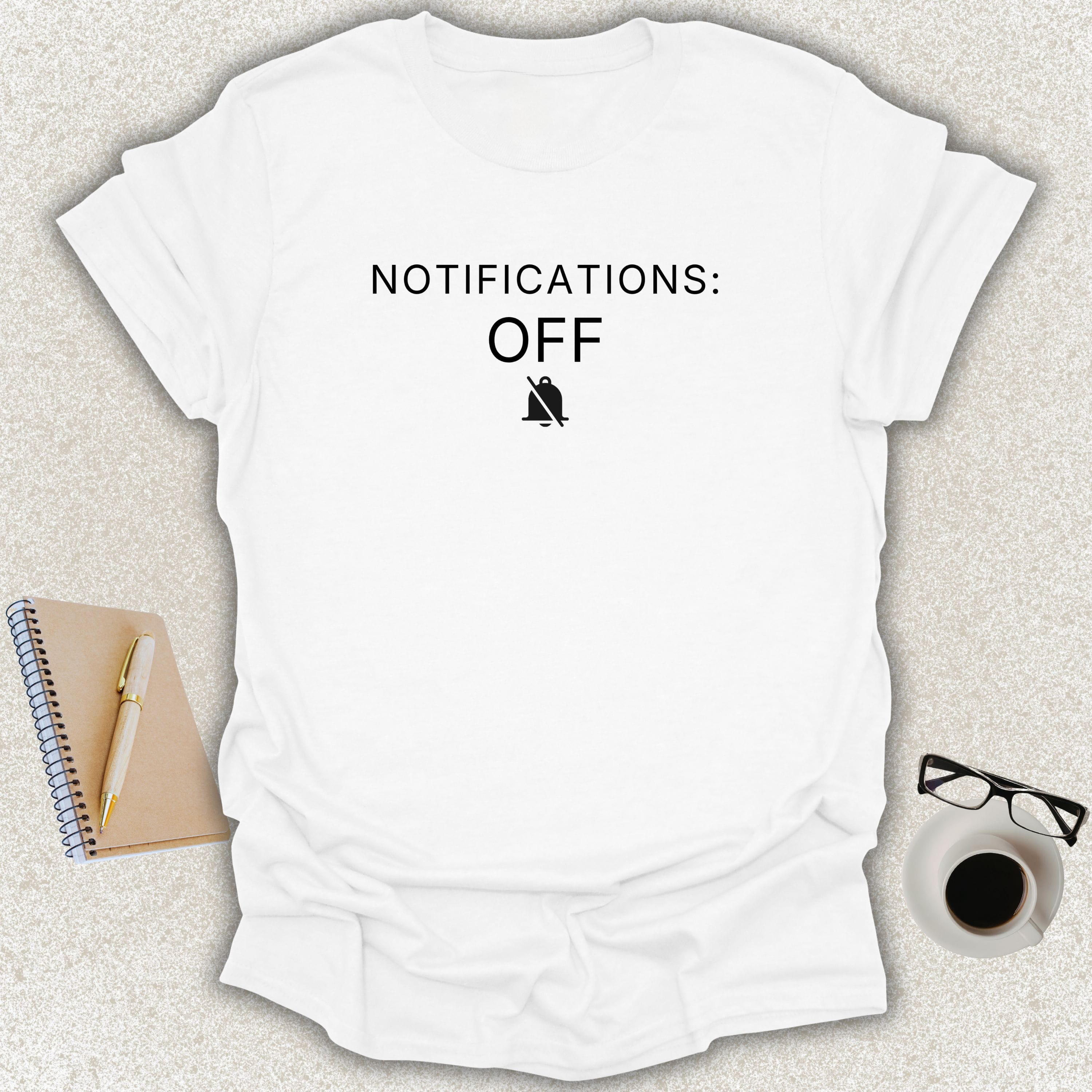 Low Signal NOTIFICATIONS: OFF minimalist typography t-shirt with muted notification bell icon on white Gildan Softstyle tee