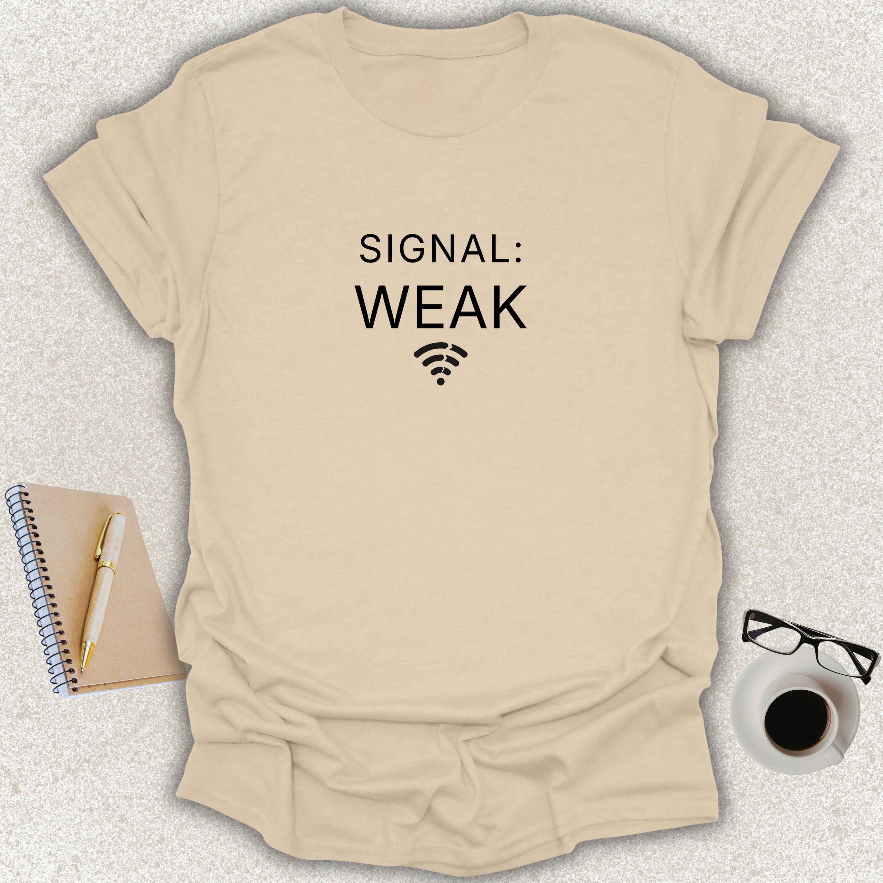 SIGNAL: WEAK minimalist typography t-shirt with Wi-Fi icon on sand Gildan Softstyle shirt